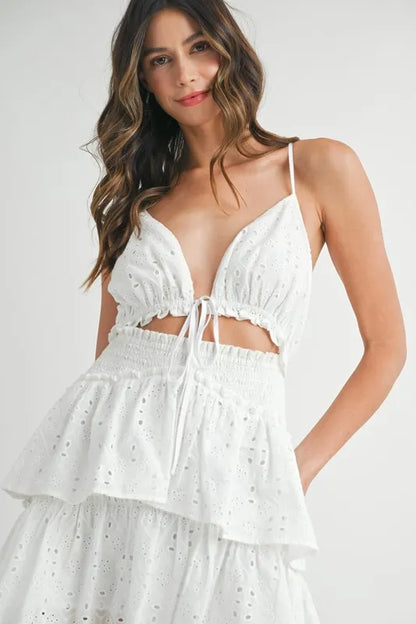 Close-up of cutout front detail and scalloped lace trim on mini dress bodice